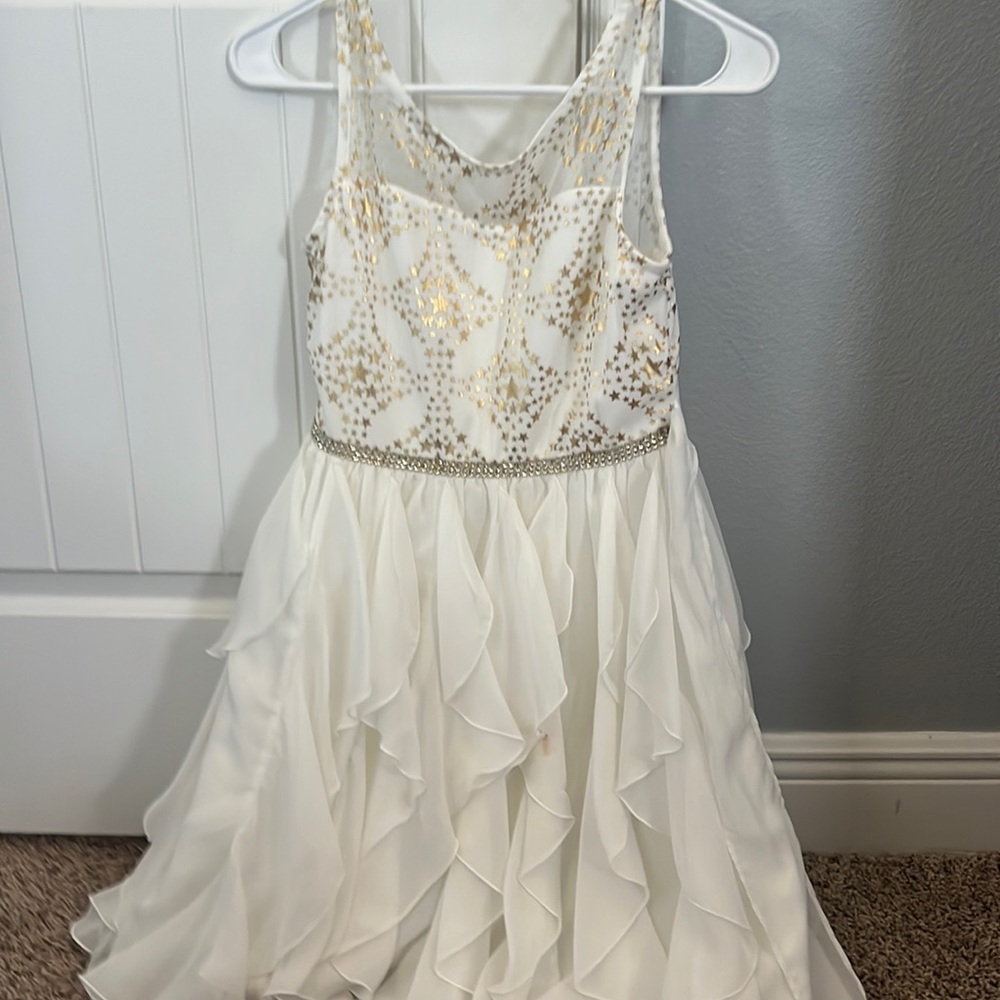 ruffled and sparkly white and gold dress